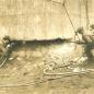 4 workers drilling at base of structure